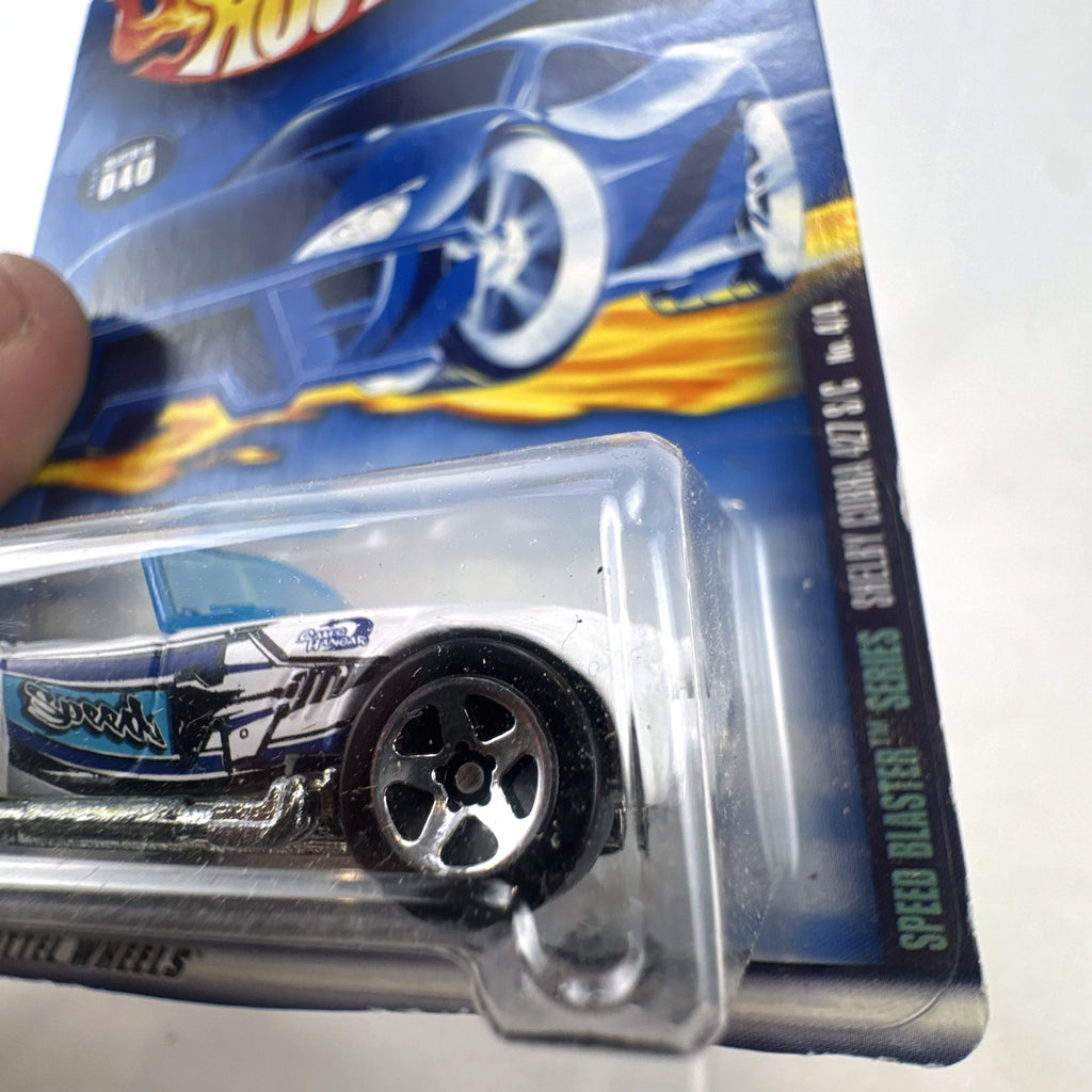 White Hot Wheels 2000 Speed Blaster Series Shelby Cobra 427 S/C diecast car sealed on its original card packaging.