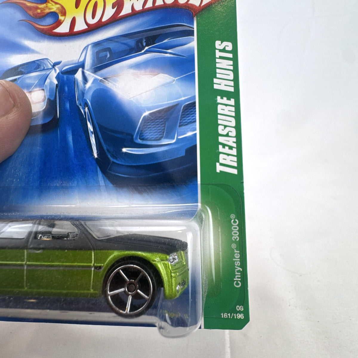 Hot Wheels 1:64 scale 2005 Chrysler 300C Treasure Hunt diecast car in metallic green, new in original blister pack.