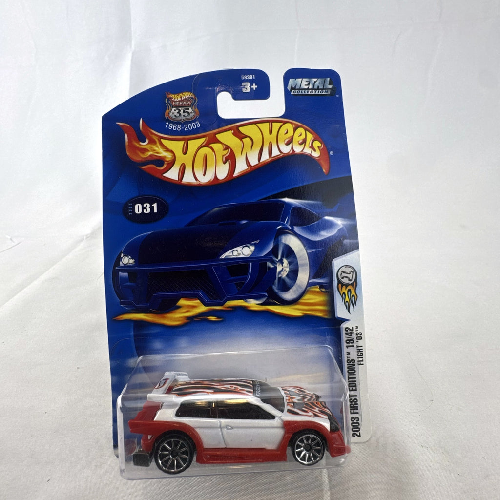 Sealed 2003 Hot Wheels First Editions Flight '03 diecast car in white with red flame graphics on original card