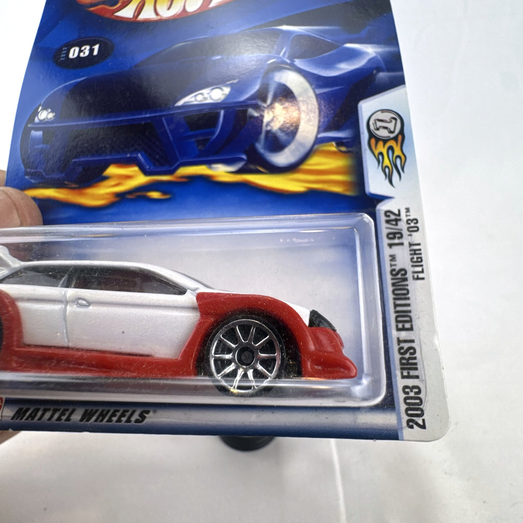 Sealed 2003 Hot Wheels First Editions Flight '03 diecast car in white with red flame graphics on original card