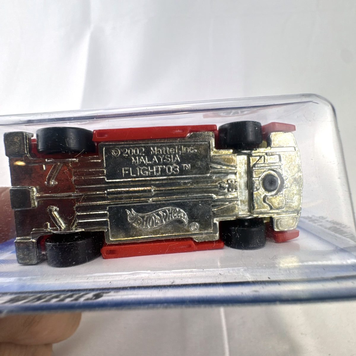 Sealed 2003 Hot Wheels First Editions Flight '03 diecast car in white with red flame graphics on original card