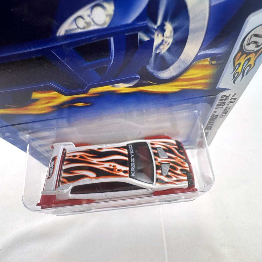 Sealed 2003 Hot Wheels First Editions Flight '03 diecast car in white with red flame graphics on original card