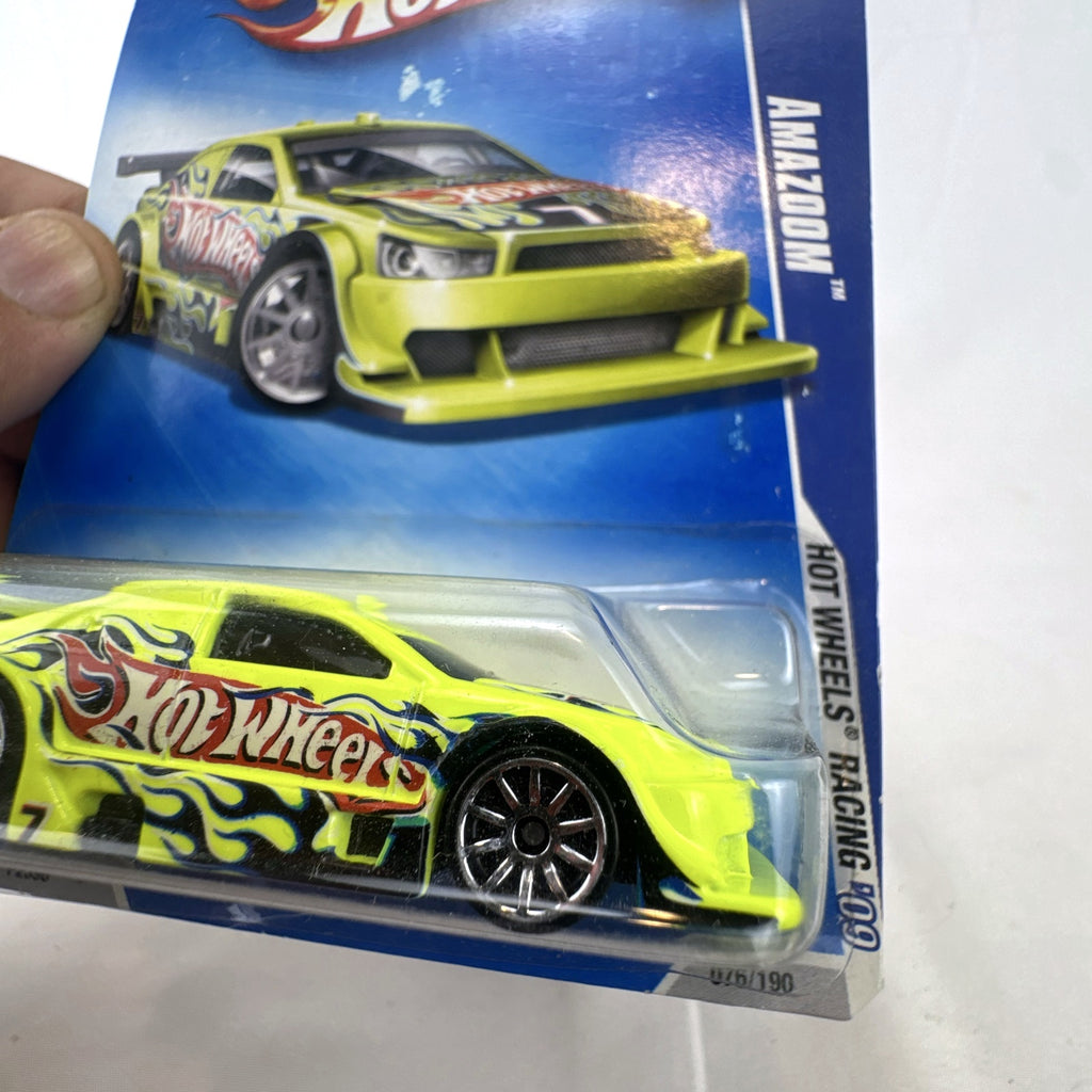 Hot Wheels Amazoom 1:64 scale diecast race car in chartreuse green with flame graphics on original blister card