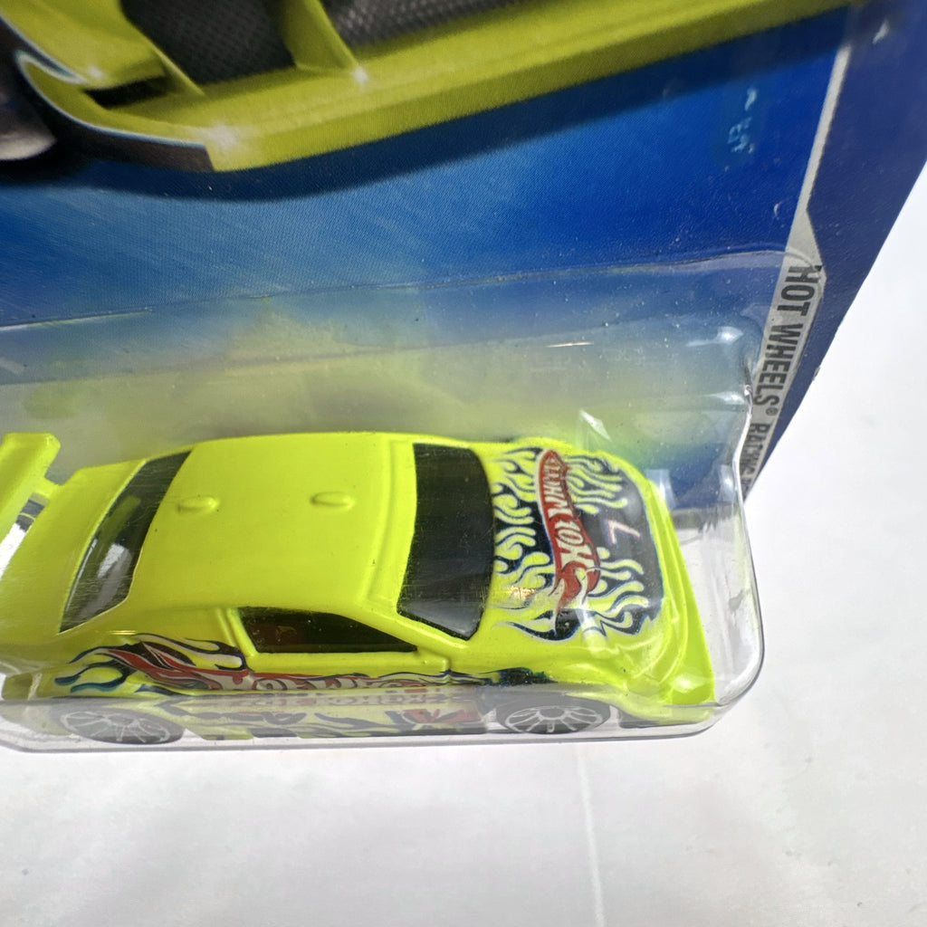 Hot Wheels Amazoom 1:64 scale diecast race car in chartreuse green with flame graphics on original blister card