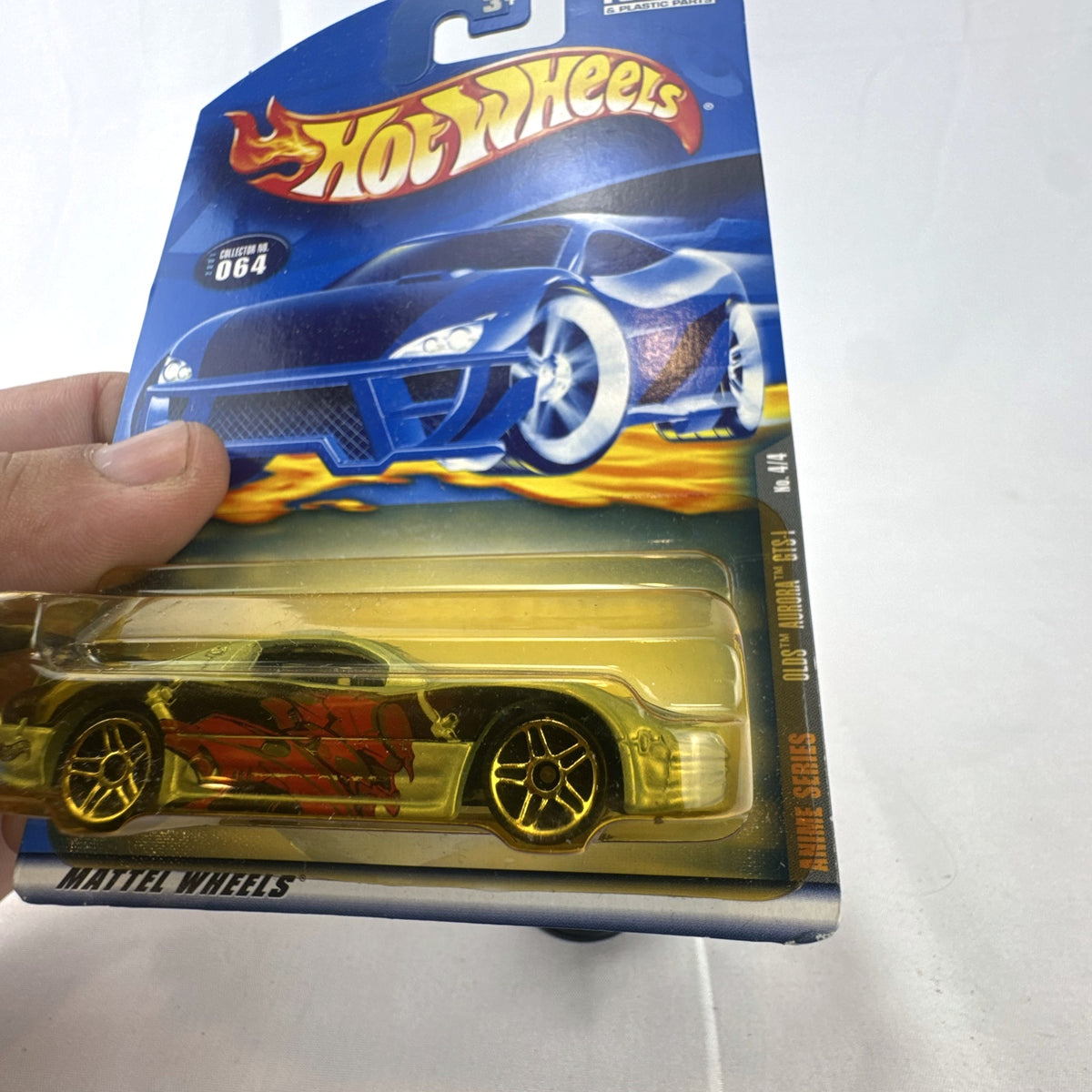 Hot Wheels 2001 Anime Series Oldsmobile Aurora GTS-1 gold diecast car in original blister package