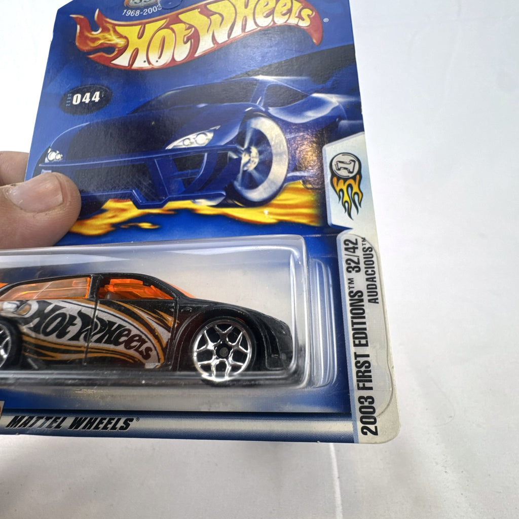 Hot Wheels 2003 First Editions Audacious diecast car in black with orange windows, unopened on card.