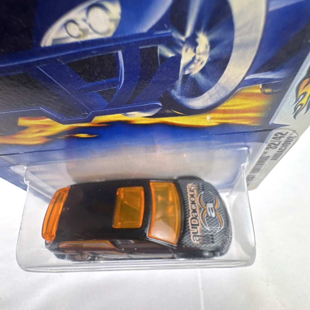 Hot Wheels 2003 First Editions Audacious diecast car in black with orange windows, unopened on card.