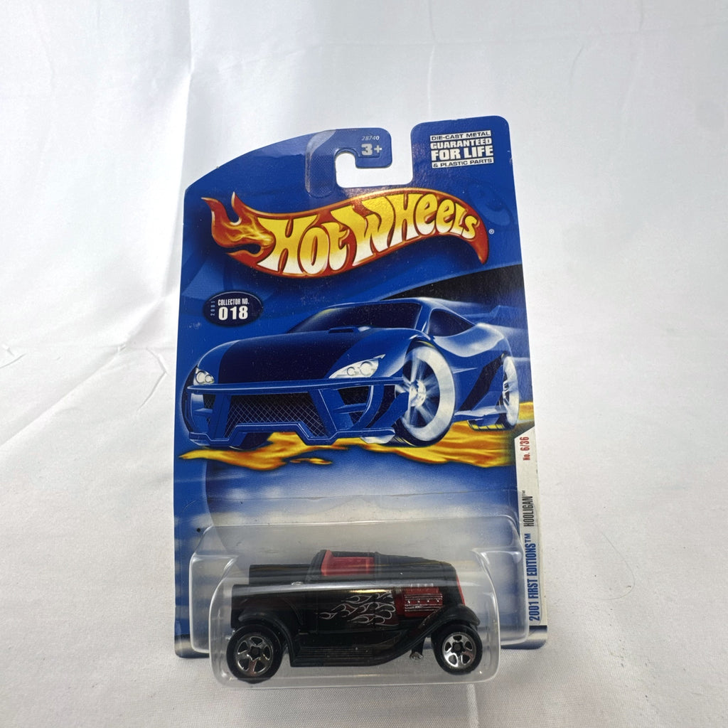 Sealed 2001 Hot Wheels First Editions Hooligan 1:64 diecast car in black with red flame graphics.
