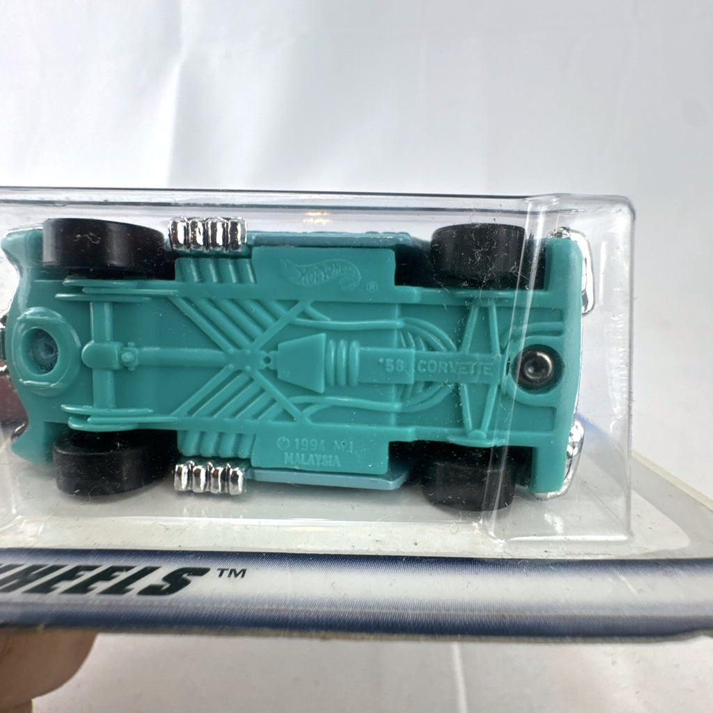 Hot Wheels 1958 Chevrolet Corvette 1:64 scale diecast car in light blue on sealed blue card packaging