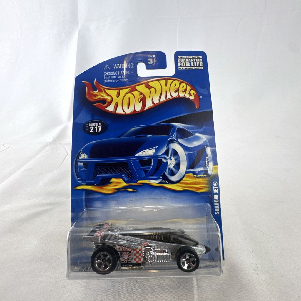 Hot Wheels 2001 Shadow Jet diecast car in chrome silver finish sealed in original card packaging.
