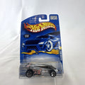 Hot Wheels 2001 Shadow Jet diecast car in chrome silver finish sealed in original card packaging.