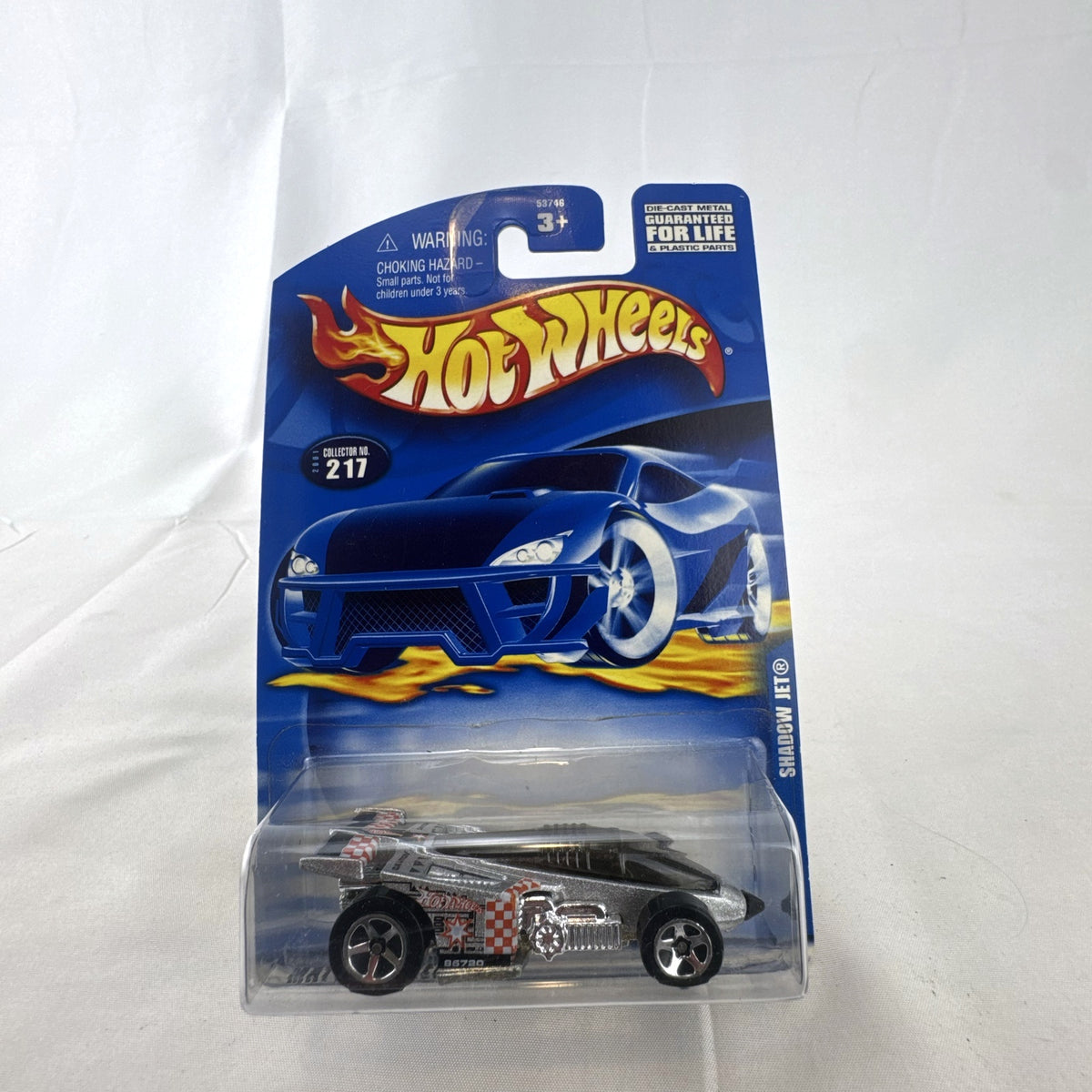 Hot Wheels 2001 Shadow Jet diecast car in chrome silver finish sealed in original card packaging.