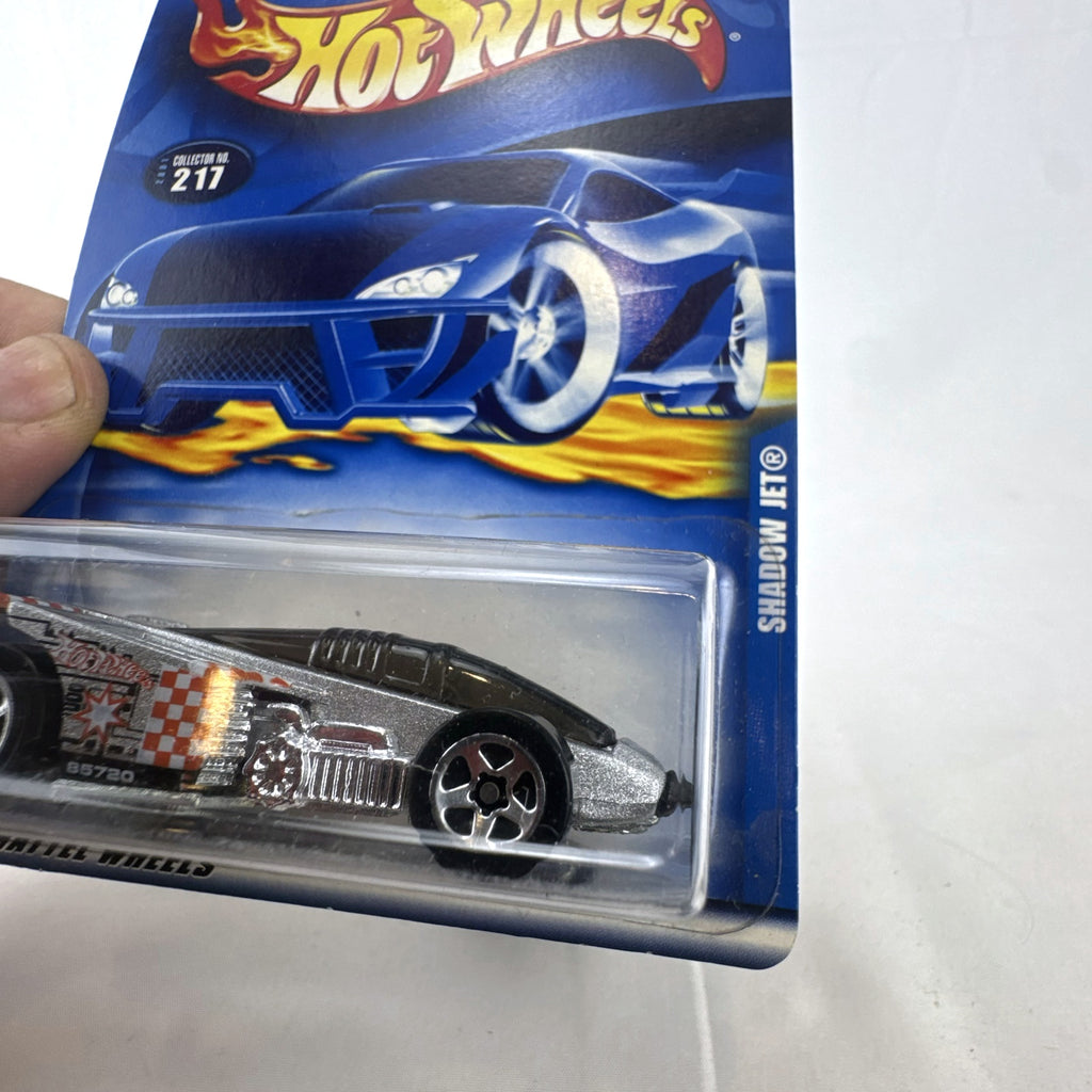 Hot Wheels 2001 Shadow Jet diecast car in chrome silver finish sealed in original card packaging.