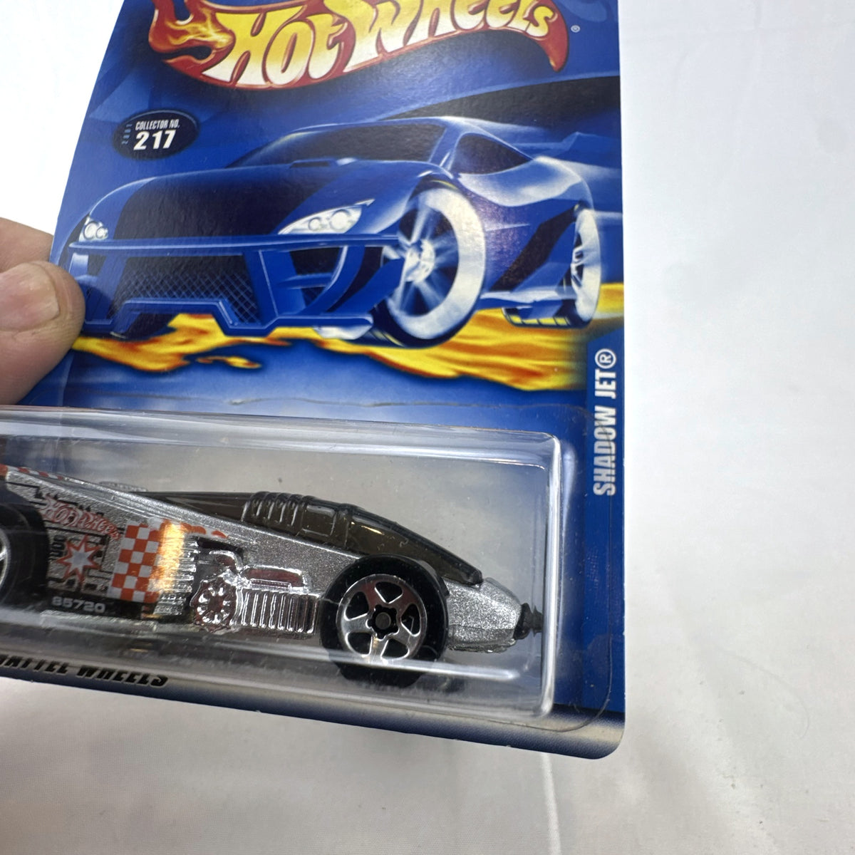 Hot Wheels 2001 Shadow Jet diecast car in chrome silver finish sealed in original card packaging.