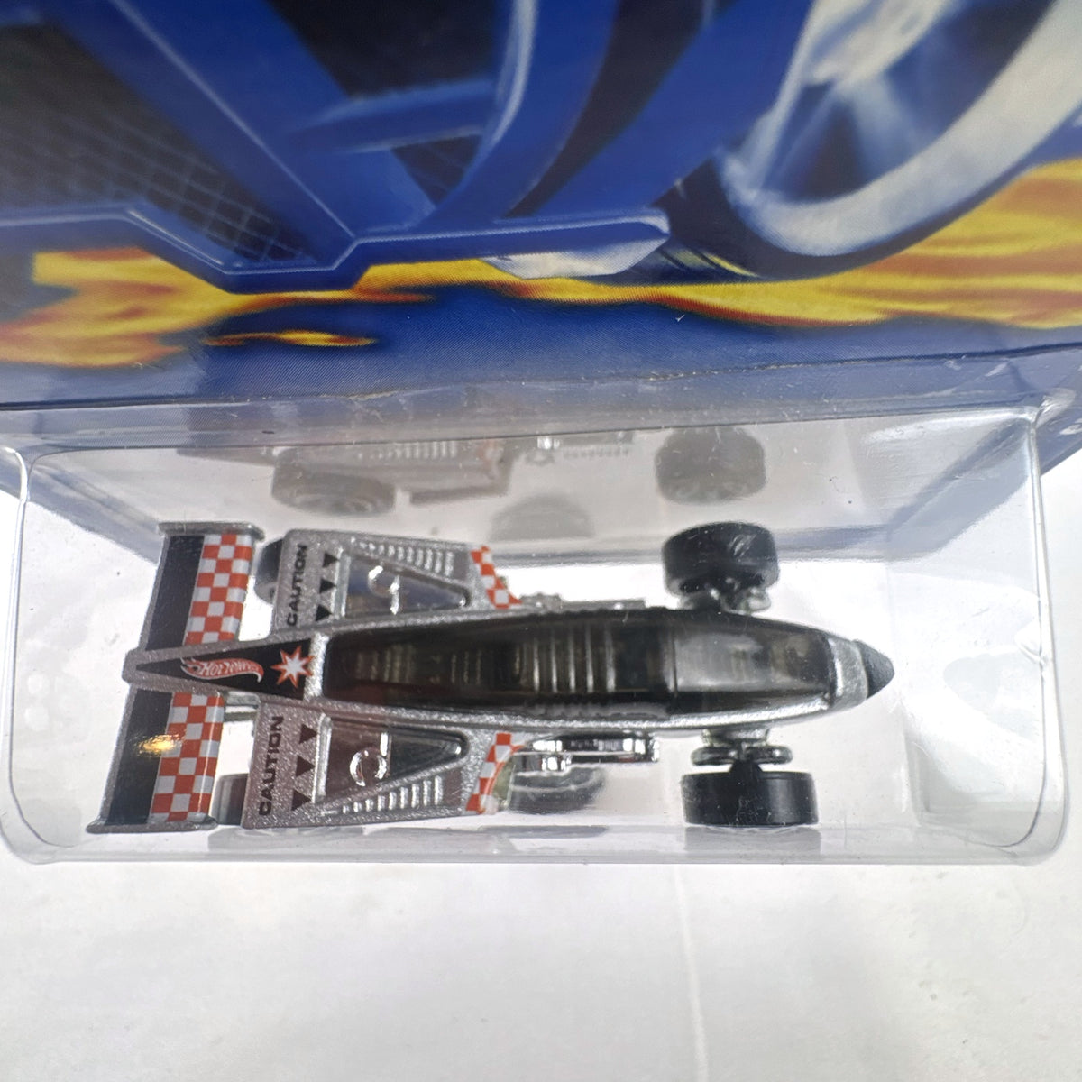 Hot Wheels 2001 Shadow Jet diecast car in chrome silver finish sealed in original card packaging.
