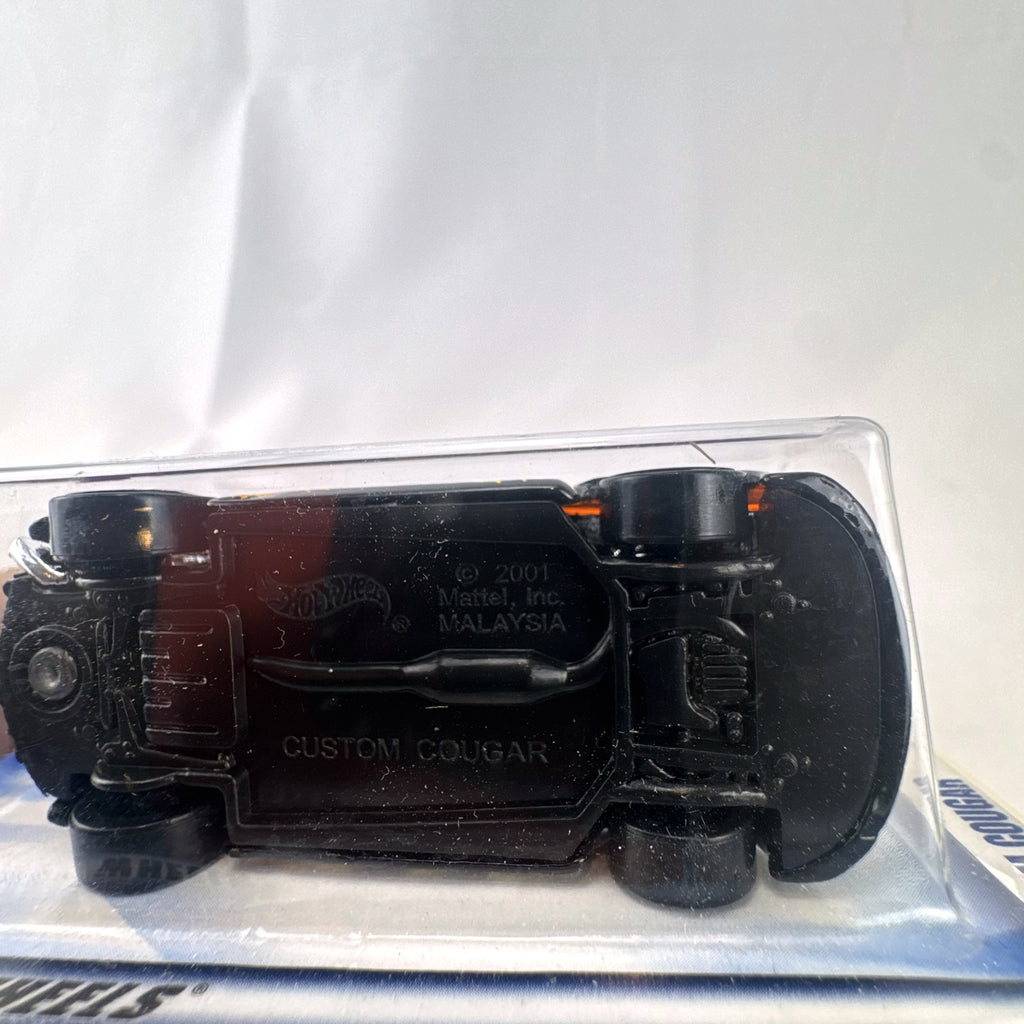 Hot Wheels 2002 First Editions Custom Cougar 1:64 diecast car in black with yellow and orange flames, factory sealed on card.