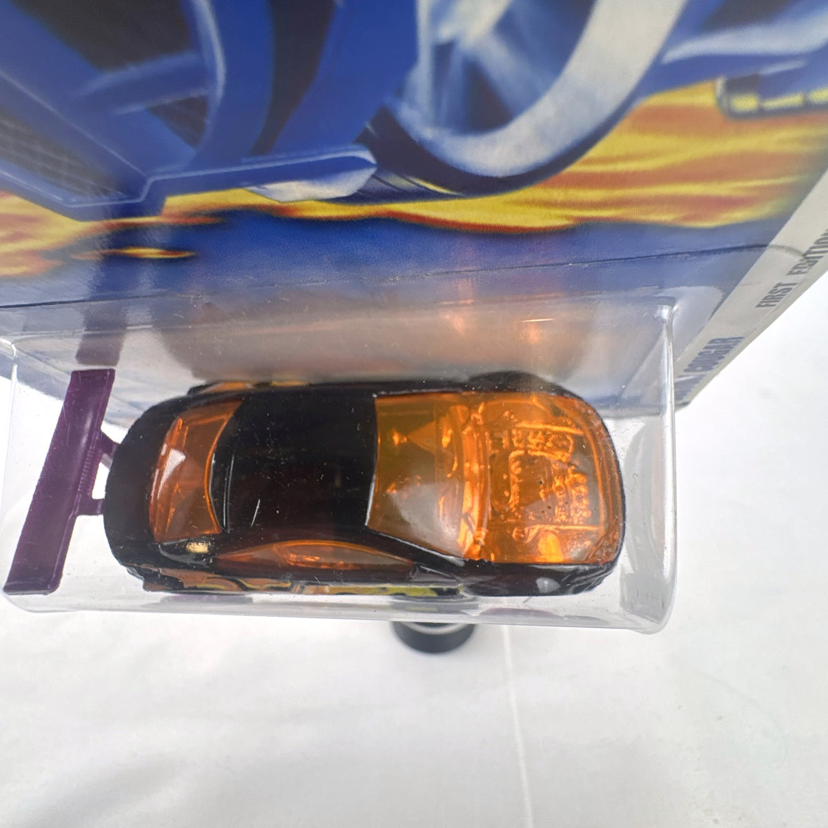 Hot Wheels 2002 First Editions Custom Cougar 1:64 diecast car in black with yellow and orange flames, factory sealed on card.