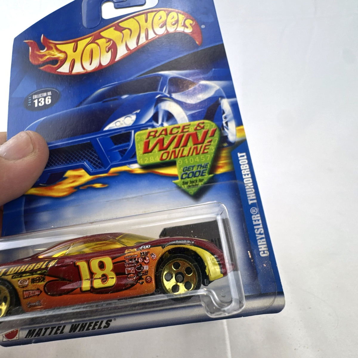 Sealed 2002 Hot Wheels Chrysler Thunderbolt Concept diecast car in dark red with #18 racing graphics on blister card