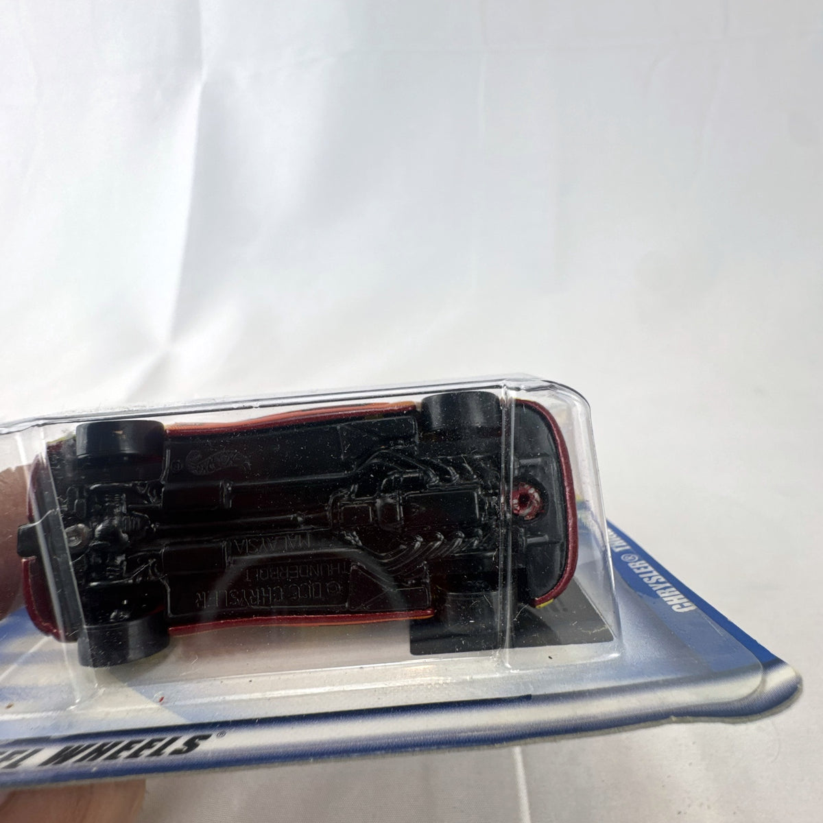 Sealed 2002 Hot Wheels Chrysler Thunderbolt Concept diecast car in dark red with #18 racing graphics on blister card