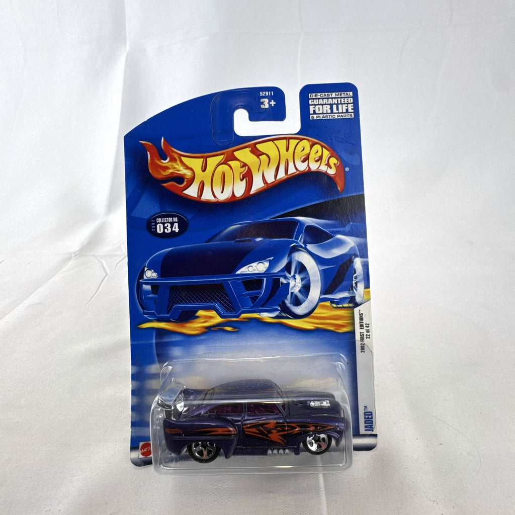 Hot Wheels 2002 First Editions Jaded diecast car in metallic purple with flame graphics in blister card package