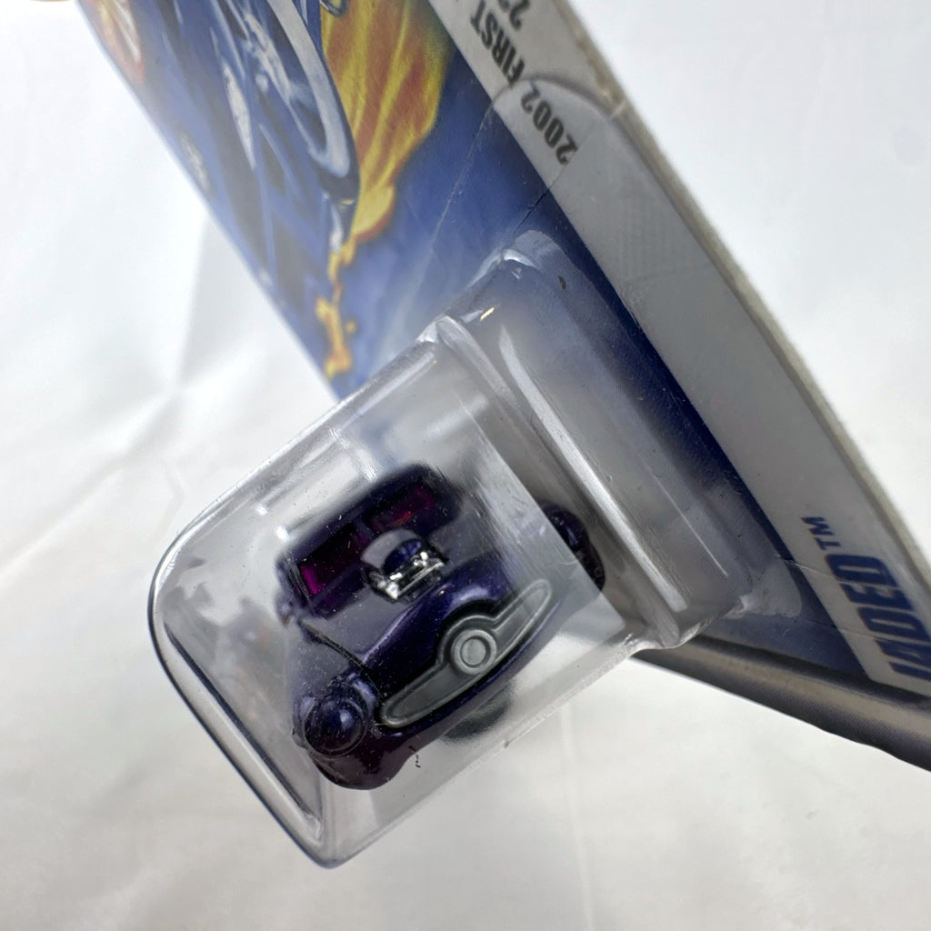 Hot Wheels 2002 First Editions Jaded diecast car in metallic purple with flame graphics in blister card package