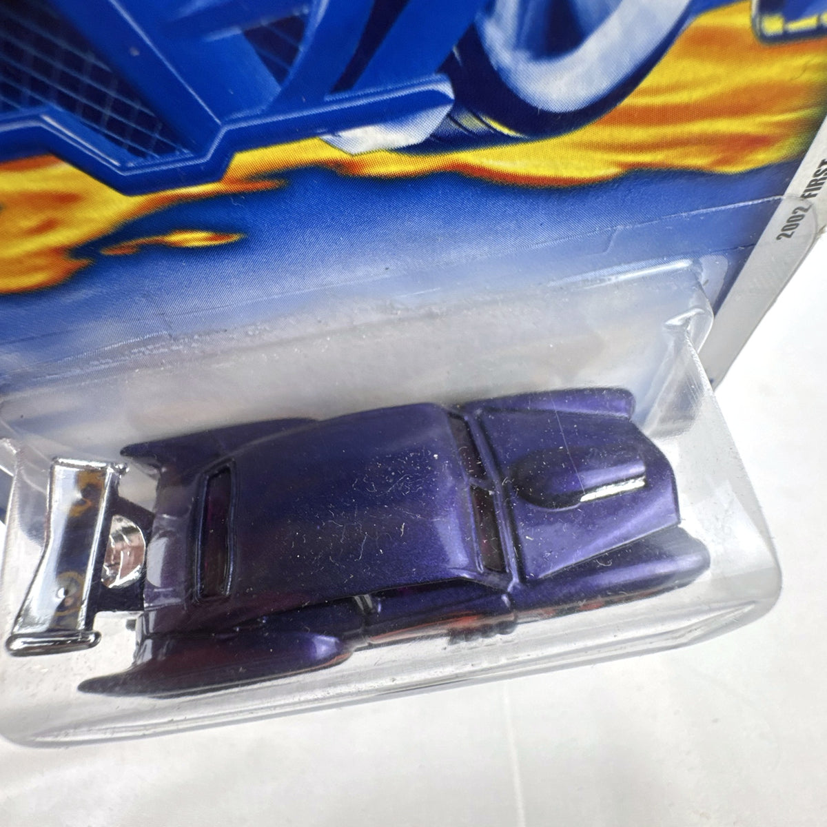 Hot Wheels 2002 First Editions Jaded diecast car in metallic purple with flame graphics in blister card package