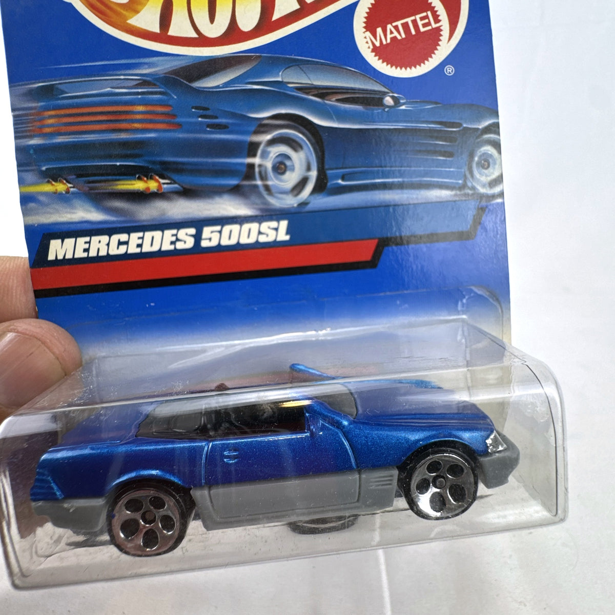 Hot Wheels 1:64 scale 1989 Mercedes-Benz 500SL convertible diecast car in metallic blue on original 2000 card.