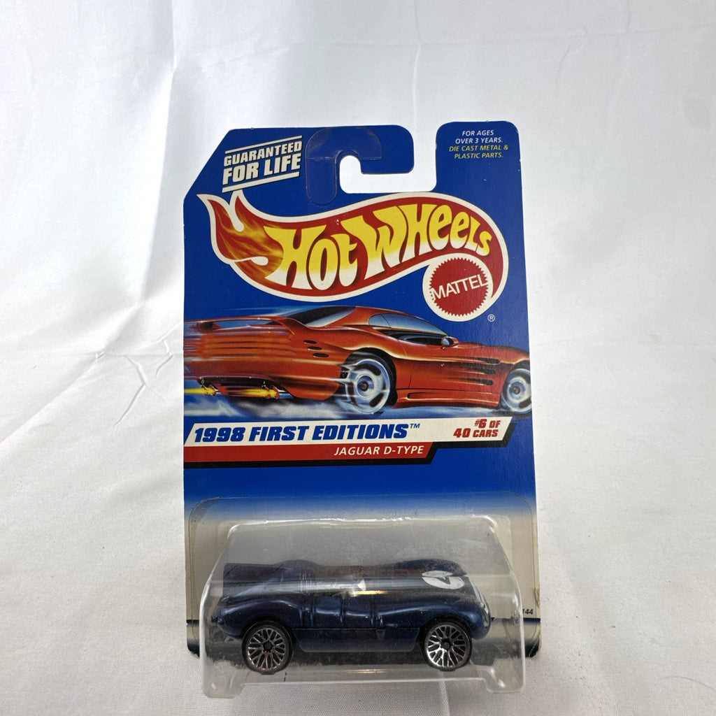 Hot Wheels 1998 First Editions Jaguar D-Type 1:64 diecast car in dark metallic blue factory sealed packaging