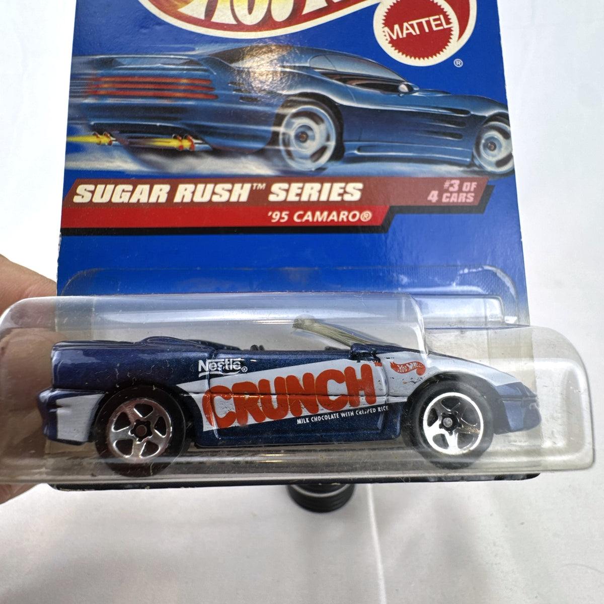 Hot Wheels 1995 Chevrolet Camaro Convertible in dark metallic blue with Nestle Crunch graphics on original card