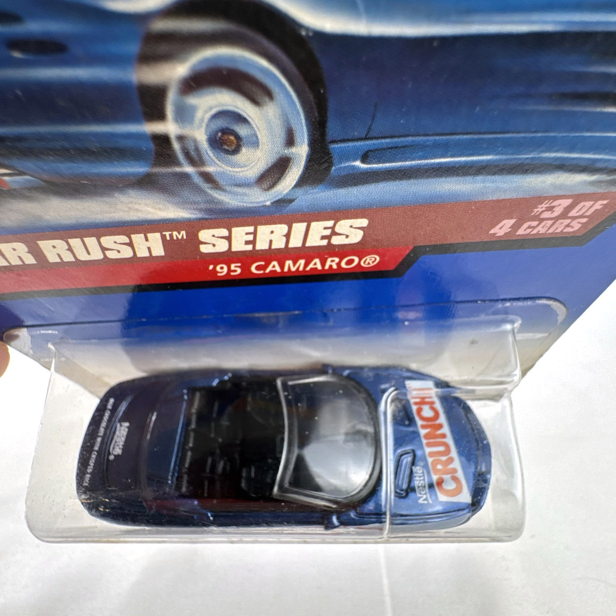 Hot Wheels 1995 Chevrolet Camaro Convertible in dark metallic blue with Nestle Crunch graphics on original card