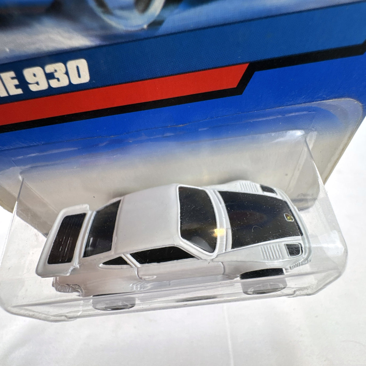 Sealed Hot Wheels 2000 Mainline Porsche 930 Turbo 1:64 diecast car in white on original blister card