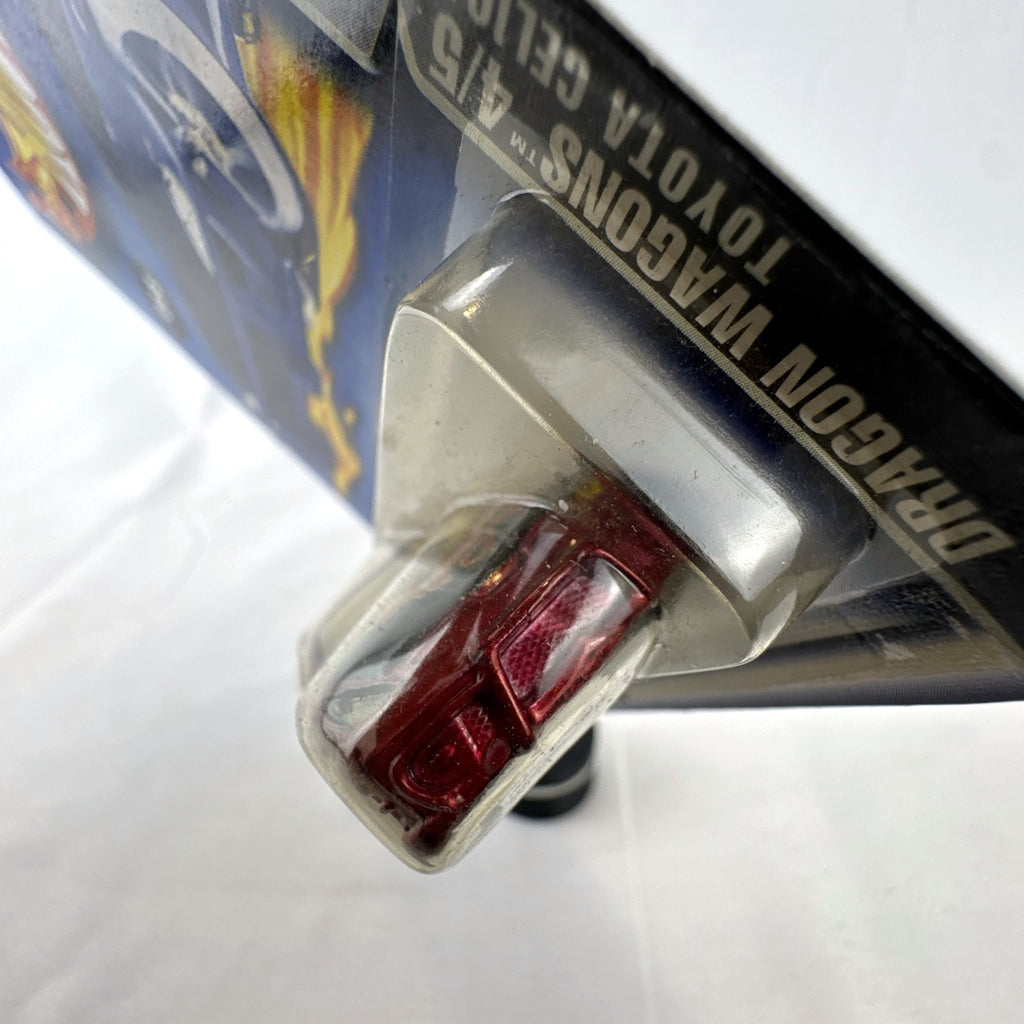 2003 Hot Wheels Toyota Celica Dragon Wagons diecast car in metallic red sealed on card
