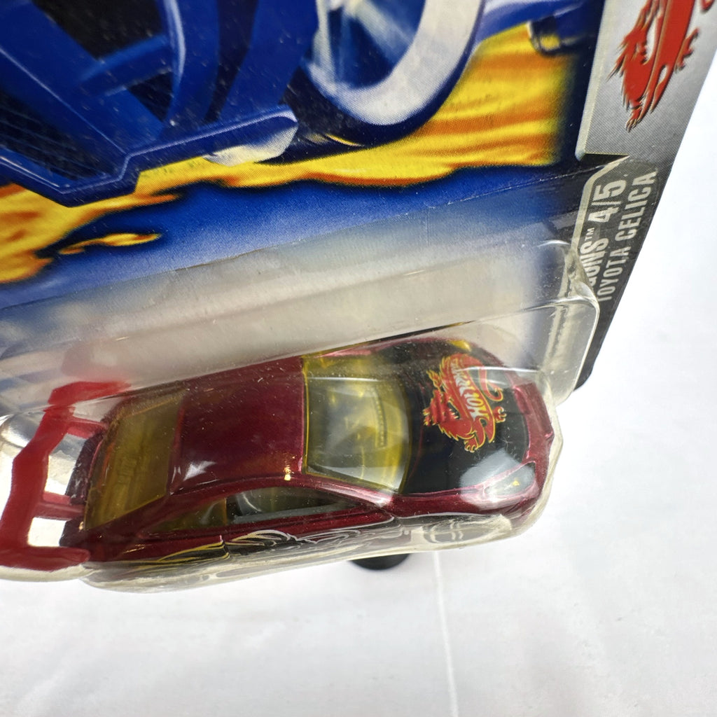 2003 Hot Wheels Toyota Celica Dragon Wagons diecast car in metallic red sealed on card