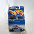 Hot Wheels 1:64 scale silver State Police K9 Unit cruiser diecast car sealed on original card packaging