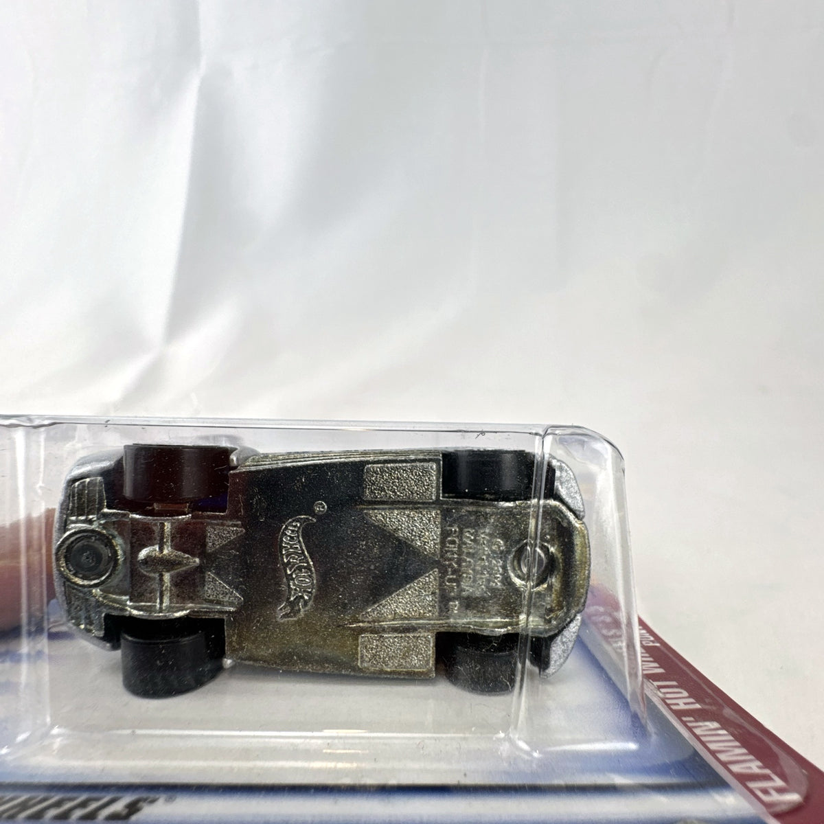 Hot Wheels 2003 Flamin' Hot Wheels Pony-Up 1:64 diecast car in silver with blue flames, factory sealed on blister card.