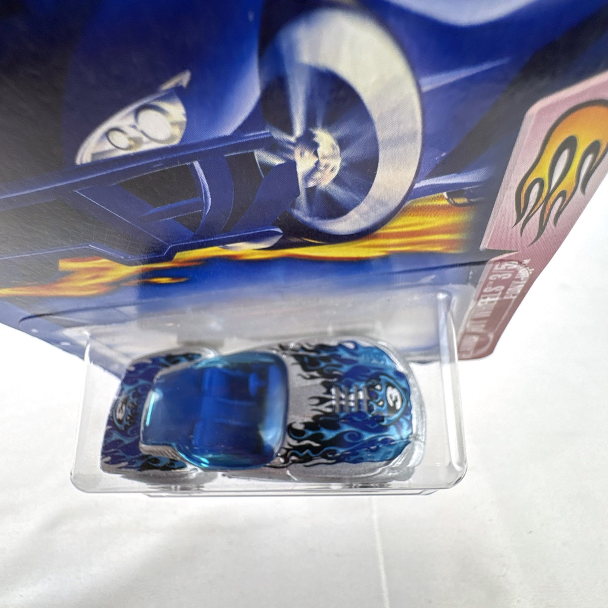 Hot Wheels 2003 Flamin' Hot Wheels Pony-Up 1:64 diecast car in silver with blue flames, factory sealed on blister card.