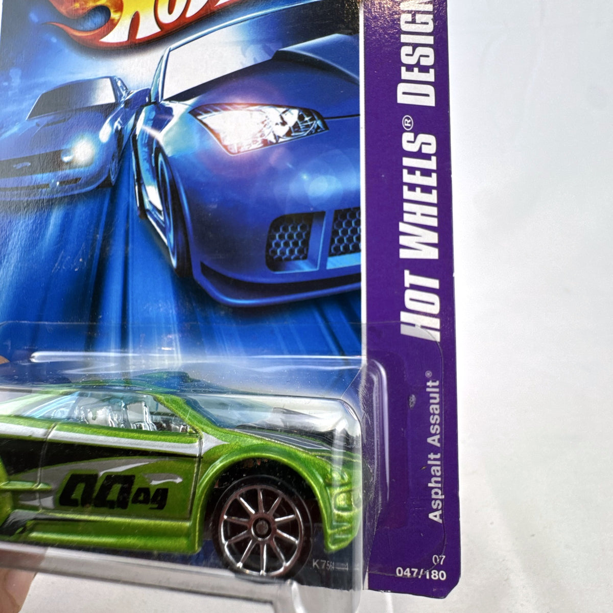 Hot Wheels Asphalt Assault 1:64 diecast car in metallic green sealed on original short card packaging.