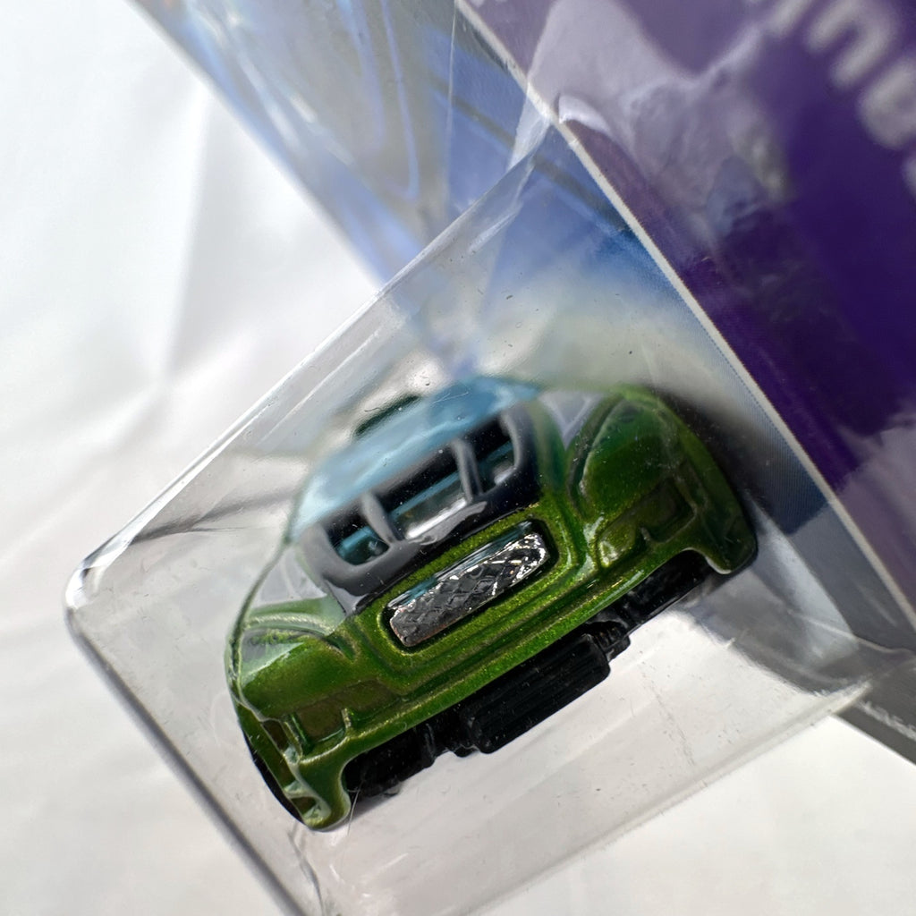 Hot Wheels Asphalt Assault 1:64 diecast car in metallic green sealed on original short card packaging.