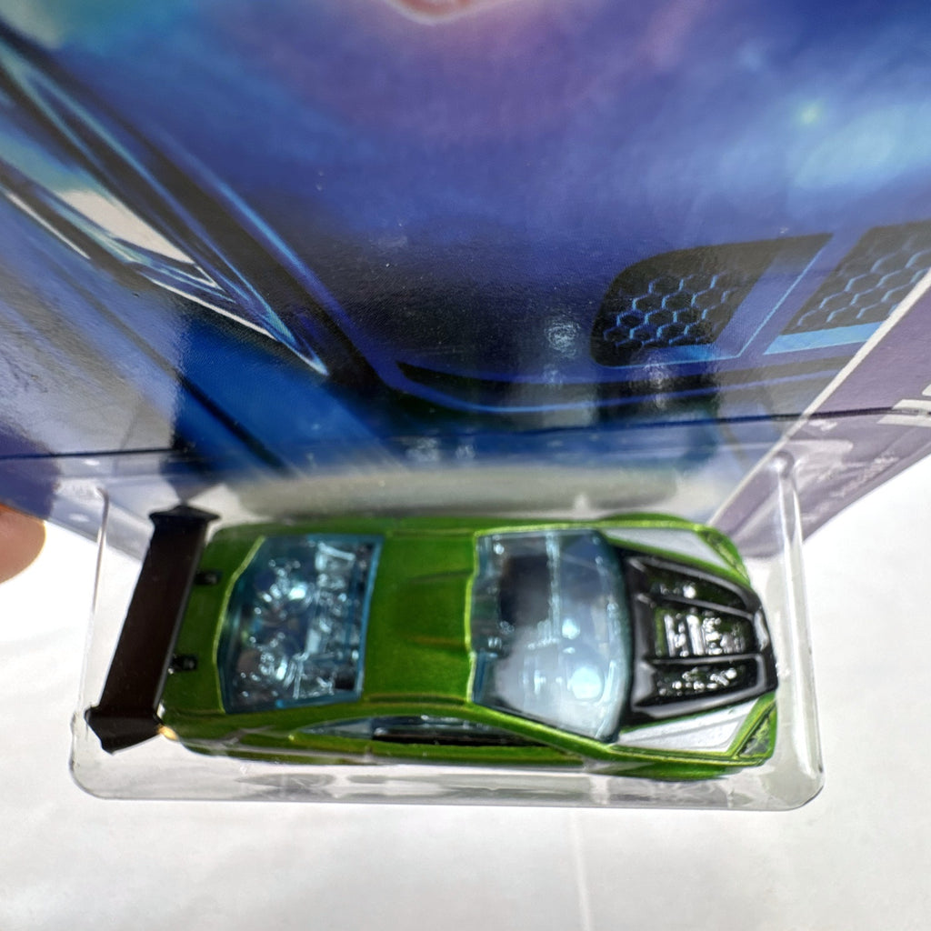 Hot Wheels Asphalt Assault 1:64 diecast car in metallic green sealed on original short card packaging.