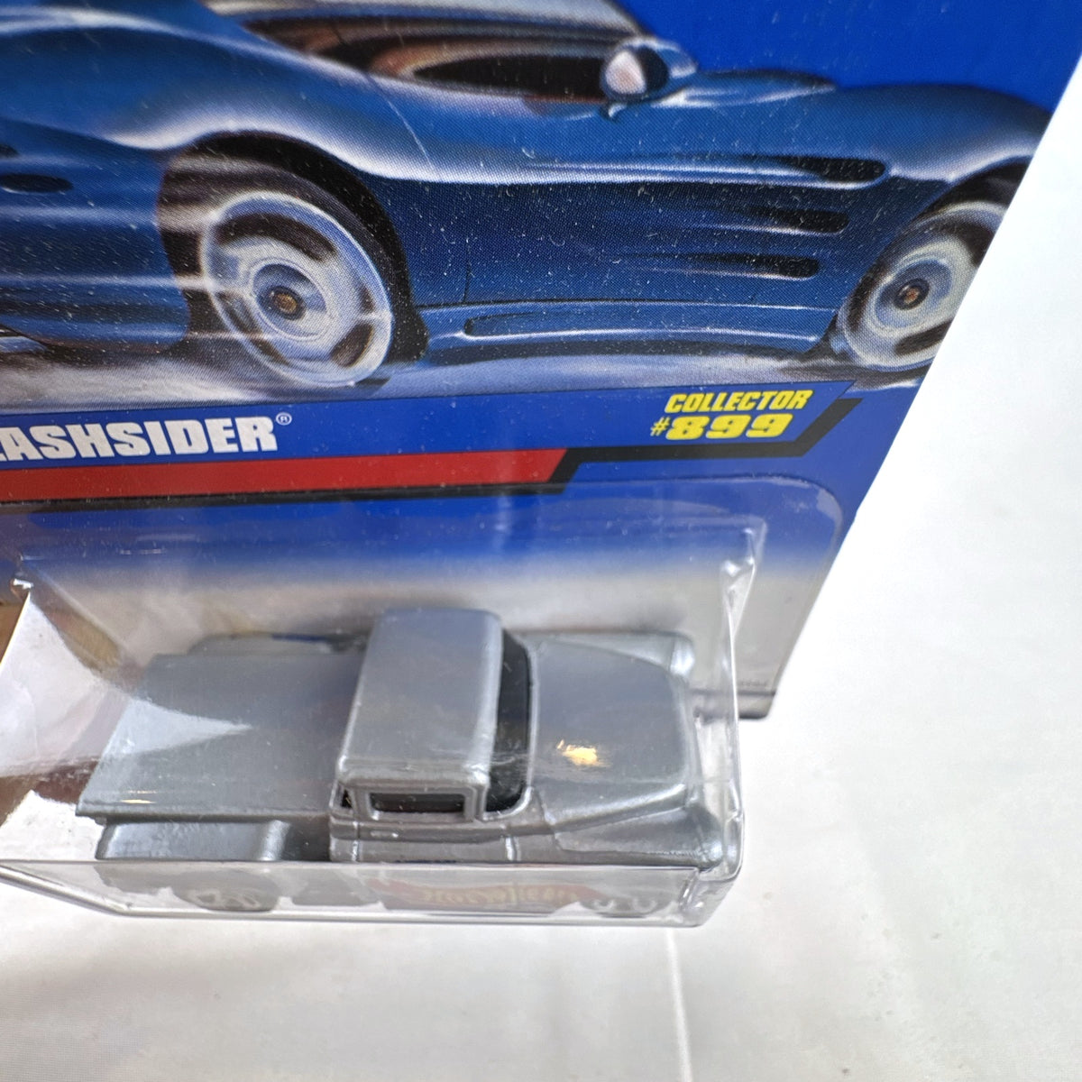 Hot Wheels 1956 Chevy Flashsider 1:64 scale diecast pickup truck in metallic silver on sealed vintage blue card