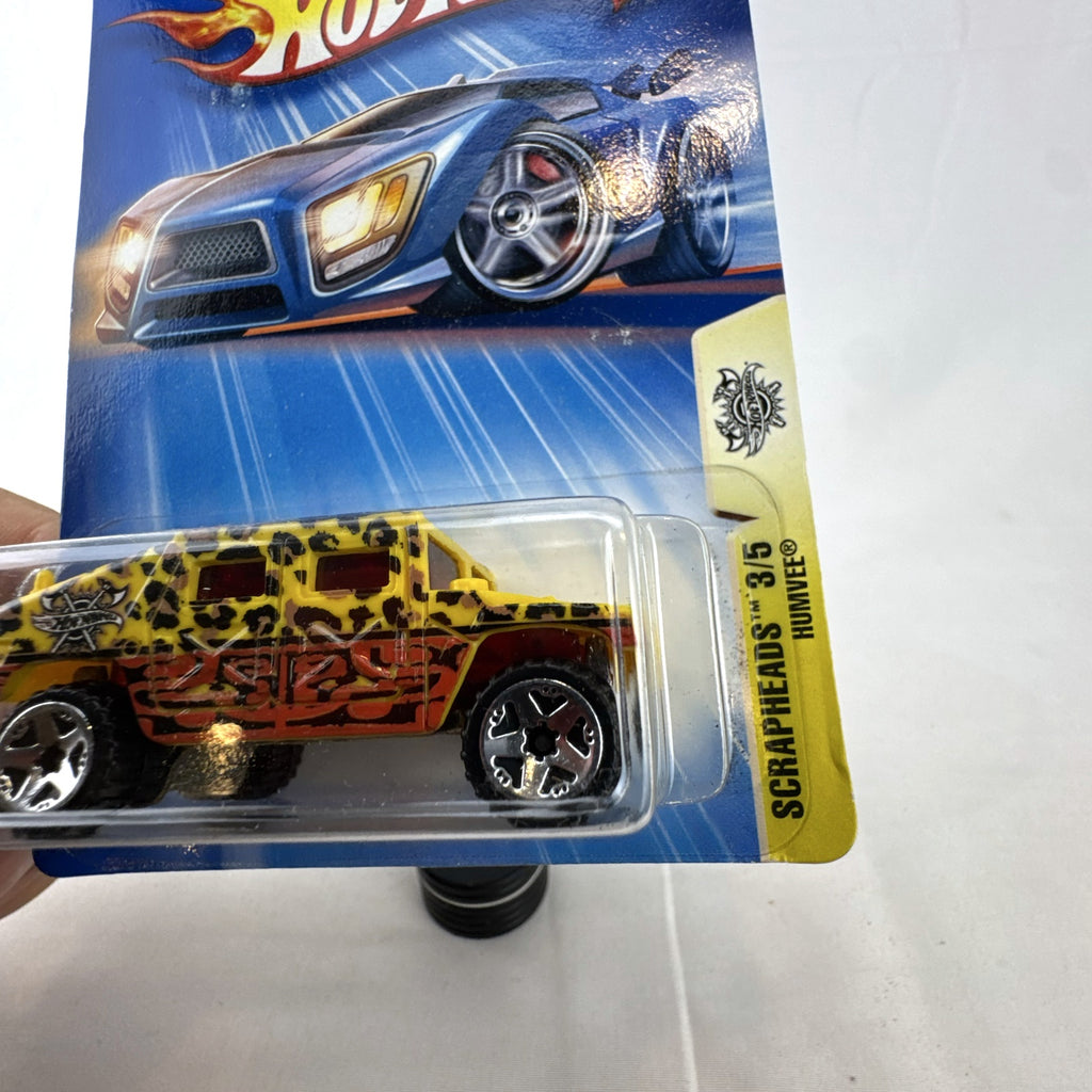 2004 Hot Wheels Scrapheads AM General Humvee 1:64 scale diecast car sealed on card in yellow with leopard print tampos
