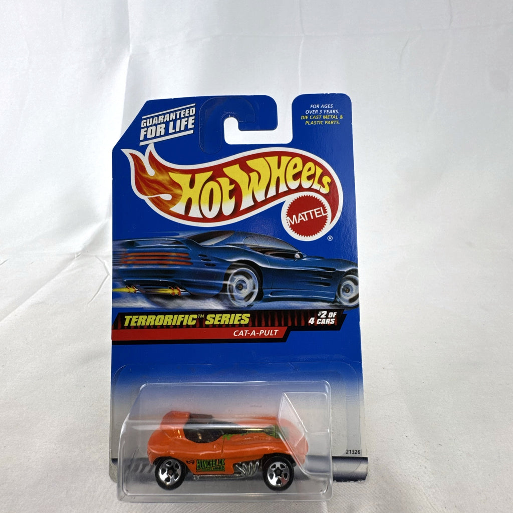 Factory sealed Hot Wheels Cat-A-Pult 1:64 scale diecast car in bright orange from the 1999 Terrorific Series.