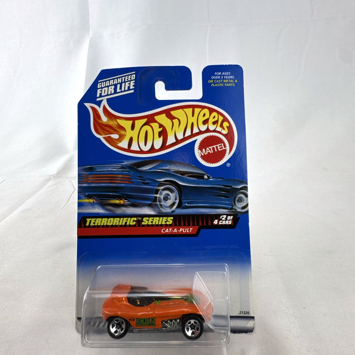 Factory sealed Hot Wheels Cat-A-Pult 1:64 scale diecast car in bright orange from the 1999 Terrorific Series.