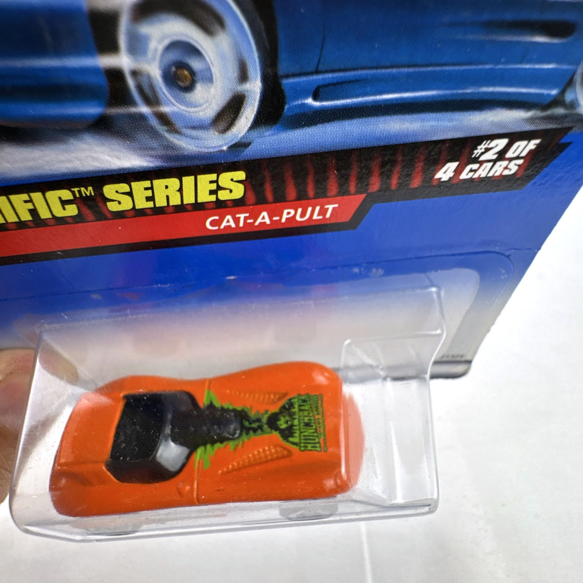 Factory sealed Hot Wheels Cat-A-Pult 1:64 scale diecast car in bright orange from the 1999 Terrorific Series.