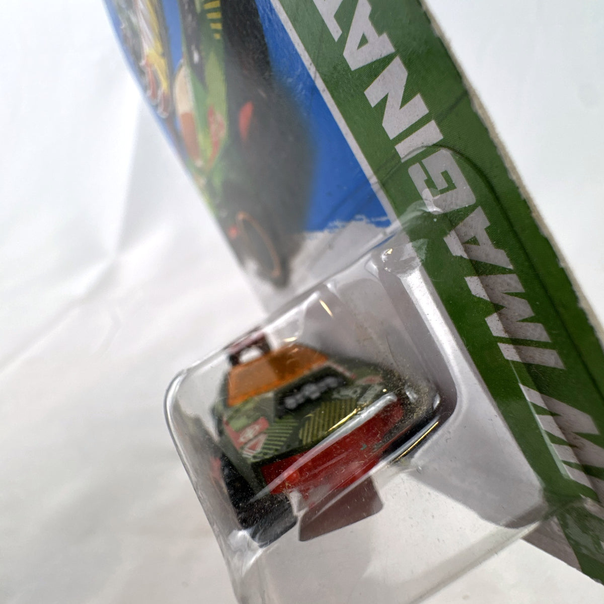 Factory sealed 1:64 scale Hot Wheels Sting Rod II diecast car in olive green on original card