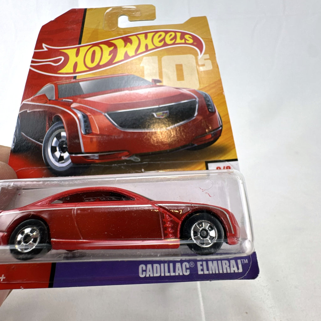 Hot Wheels 2013 Cadillac Elmiraj 1:64 scale diecast concept car in red, factory sealed on blister card.