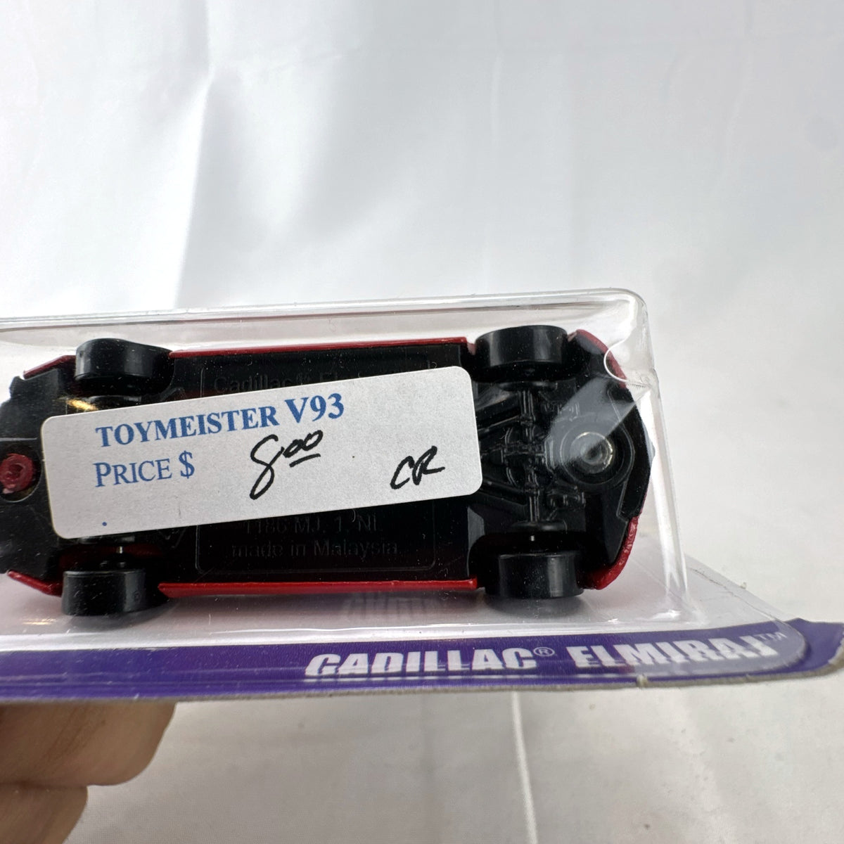 Hot Wheels 2013 Cadillac Elmiraj 1:64 scale diecast concept car in red, factory sealed on blister card.