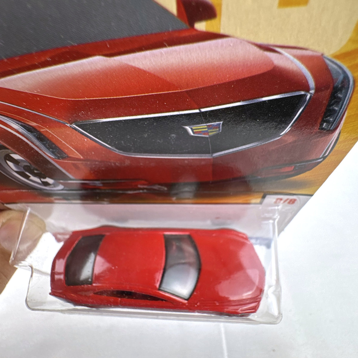 Hot Wheels 2013 Cadillac Elmiraj 1:64 scale diecast concept car in red, factory sealed on blister card.