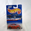 Hot Wheels Muscle Tone diecast car in metallic orange sealed on original 2000 First Editions card.