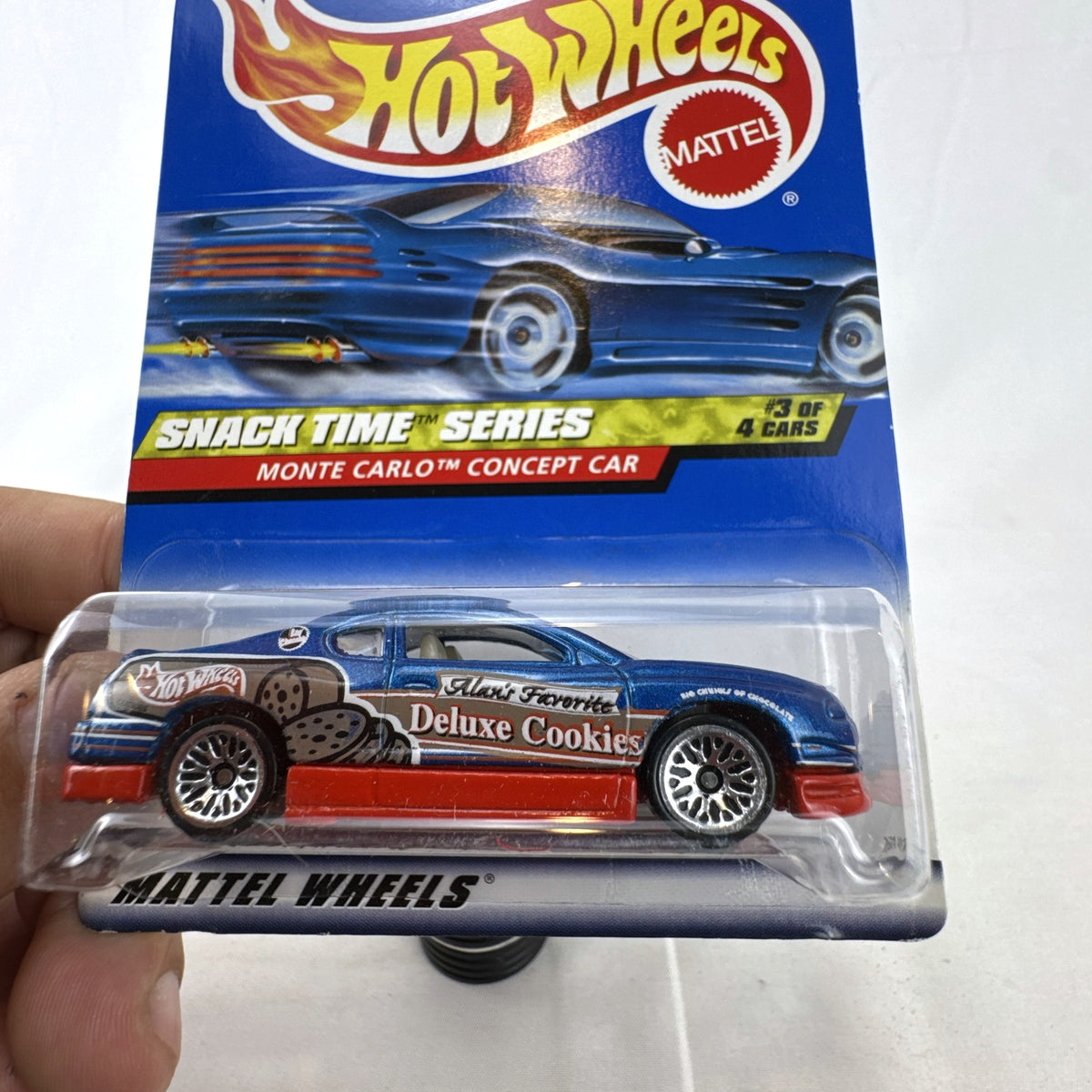 1:64 scale Hot Wheels 2000 Chevy Monte Carlo Concept car in metallic blue Snack Time Series packaging.